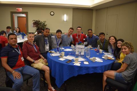 international students sitting at a round table