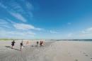 Wide angle shot of engineers measuring beach